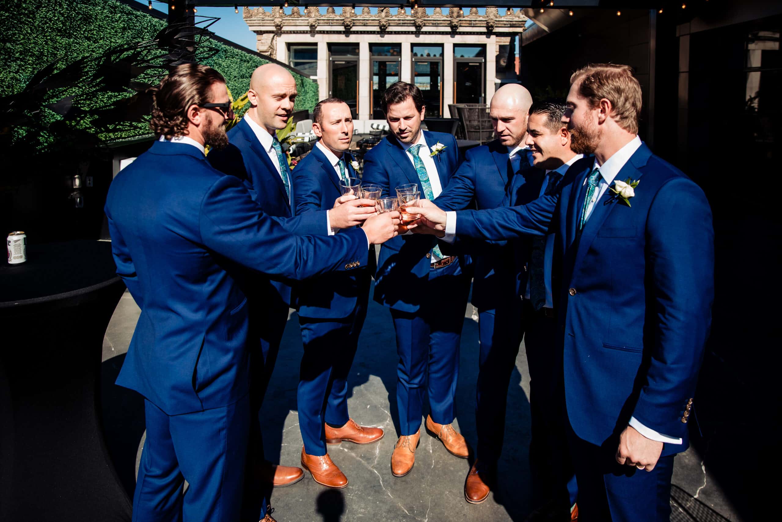 groomsmen taking shot before ceremony